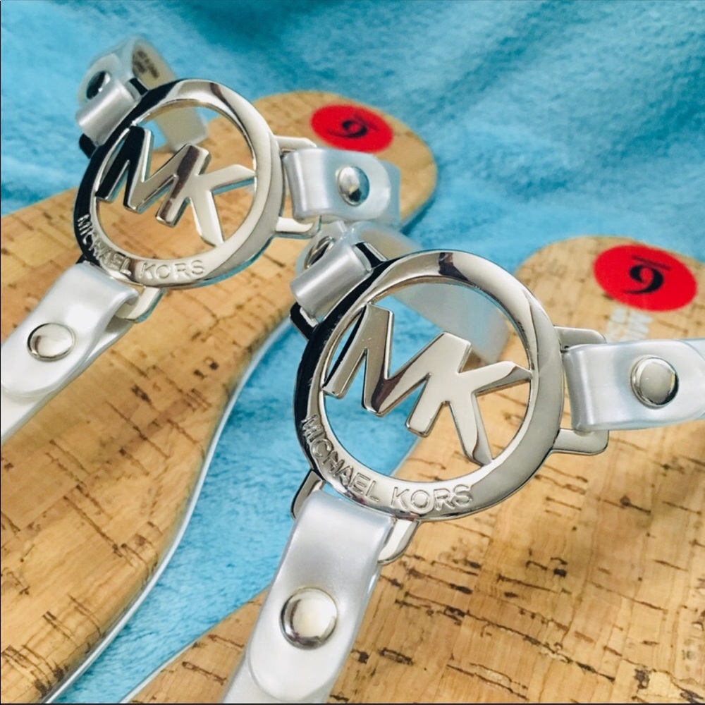 Silver MK flip flops